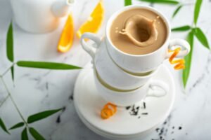 Earl grey milk tea poured in stacked cups